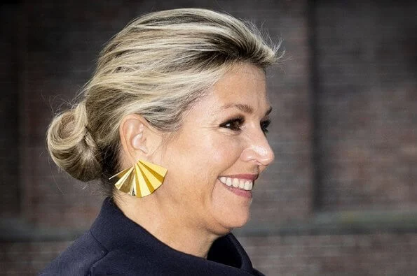 Queen Maxima visited Verkadefabriek in s-Hertogenbosch city. Susanne Friis Bjørner gold earrings and Natan top and pants