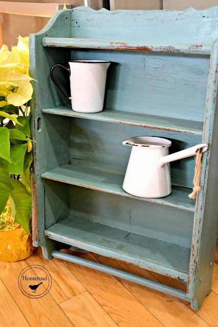 Antique shelf with enamelware mugs