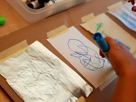 allow your child to draw on all the materials, talk about what's easy and difficult to draw on, what smears, etc