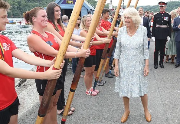 The Duchess of Cornwall wears a pale blue floral midi dress for the visit. Prince Charles, Prince Willaim, Prince Harry, Meghan Markle, kate Middleton