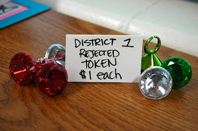 From The Capitol General Store: District 1 Rejected Token (Price is in PANEM cash, not real dollars!)