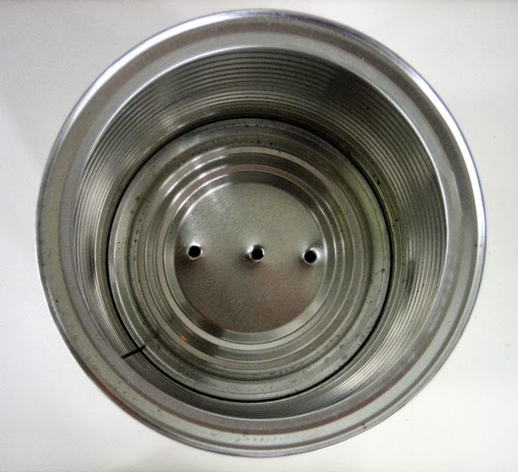 Clean out the coffee can and add three holes to the bottom