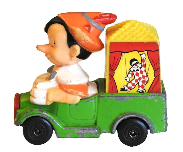 An older Pinnochio figure in a truck.