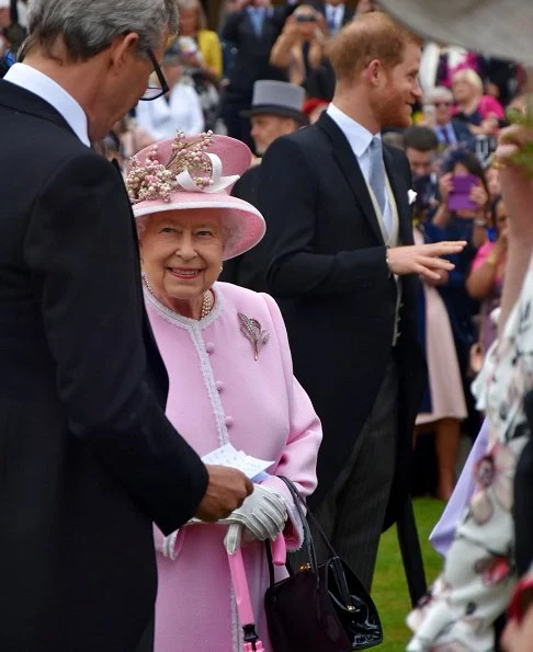 Princess Eugenie wore Sandro wrap dress. Princess Beatrice wore The Vampire's Wife floral-print silk dress. Duke of Sussex