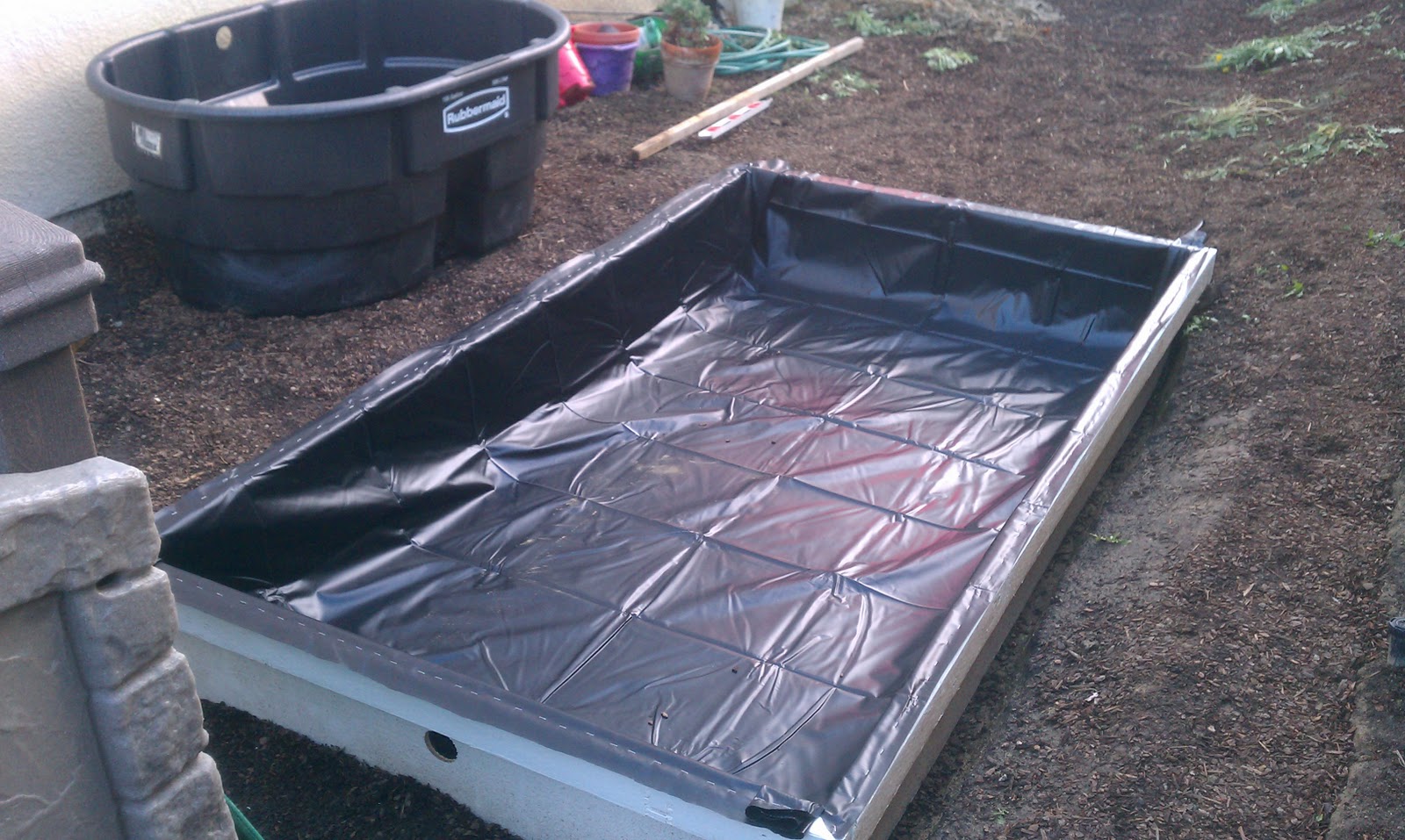 The Aquaponics Project The Pond Liner is in.