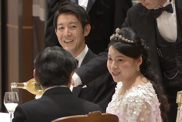 Crown Prince Naruhito and Crown Princess Masako at weeding banquet. Princess Ayako wore a pink silk dress designed by designer Norio Suzuki