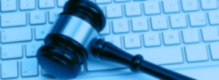 gavel lying on a computer keyboard image of gavel lying on a computer keyboard