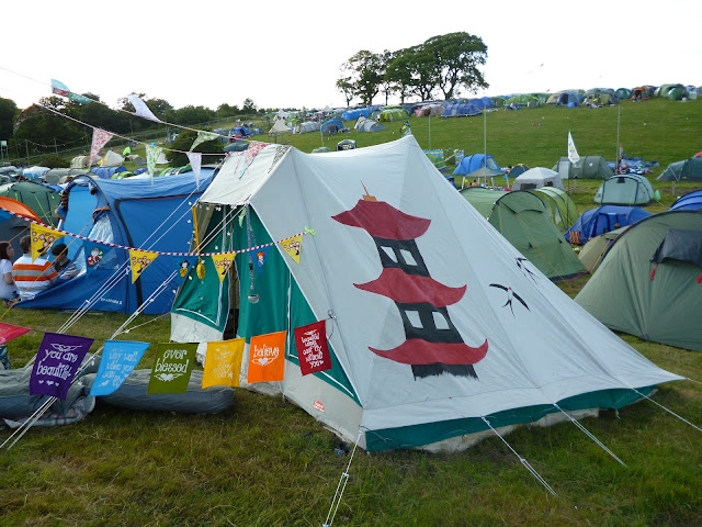painted cabanon tent at a festival with bunting