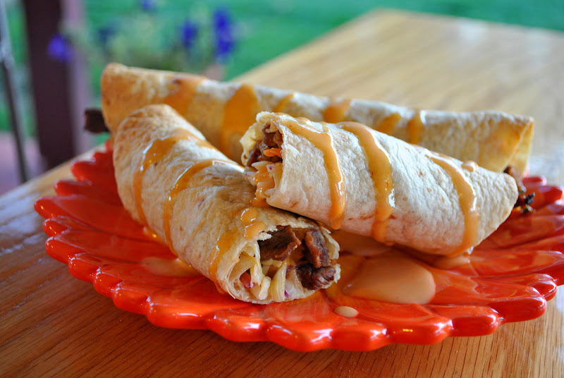 asian infused steak flautas with spicy cole slaw and creamy siracha