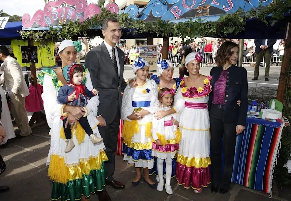 King Felipe and Queen Letizia visit Colombres, Asturias, Spain Queen Letizia wore Hugo Boss Trouser - pant, wore carolina herrera blouse, tous earrings, mango coat