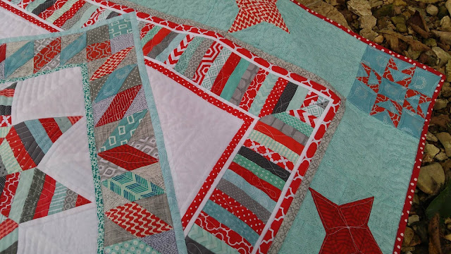 Red and aqua string star round robin quilt