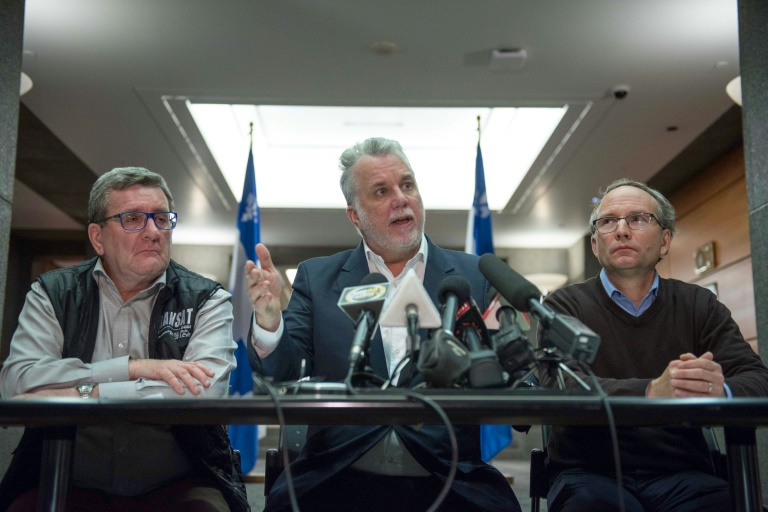 L-R: Quebec City Mayor Régis Labeaume, Quebec Prime Minister Philippe Couillard and Martin Coiteux minister of Public Security, hold a press conference on January 30, 2017