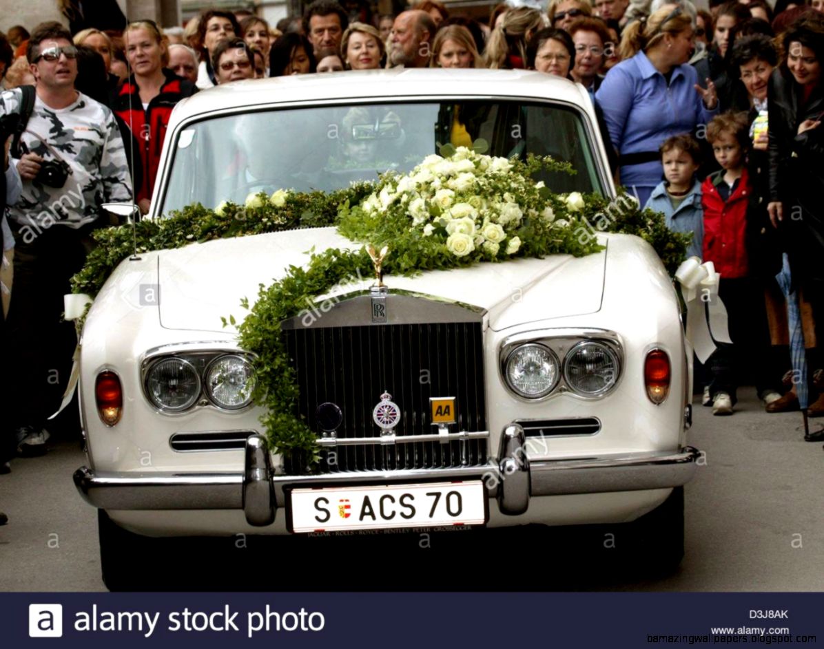 dpa   A White Rolls royce Decorated With Flowers Stands