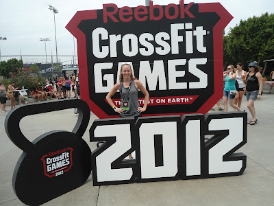 Heather Hart poses in front of the 2012 CrossFit Games sign at the 2012 CrossFit Games