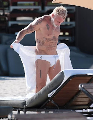 Italian millionaire, Gianluca Vacchi, 49, shows off his beach body in a tiny pair of white swimming shorts