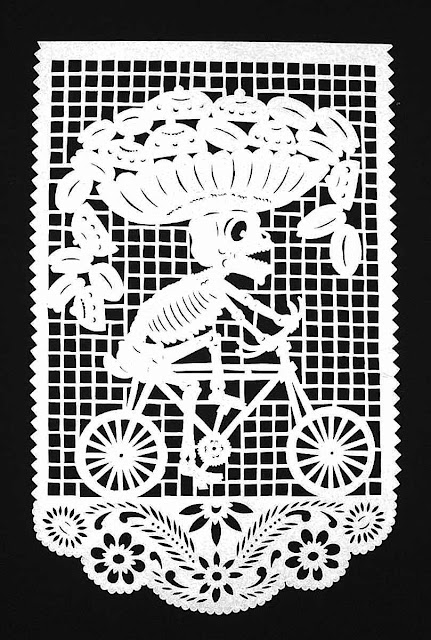 papercut skeleton A papercut skeleton on a bicycle