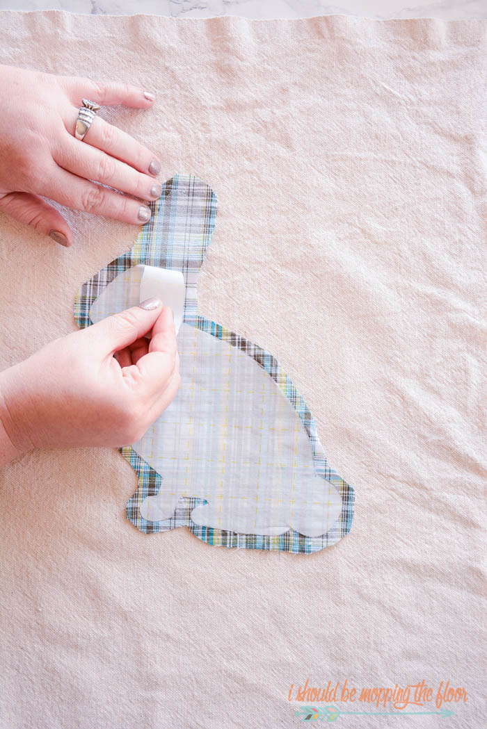 DIY Frayed Edge Appliqué Pillow: Sweet little bunny pillow made from a canvas drop cloth and men's shirt. Free printable bunny template available, too.