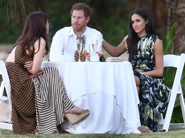 Prince Harry went to Jamaica in order to attend the wedding ceremony of the couple Tom Inskip and Lara Hughes-Young. Meghan Markle wore a bird printed silk maxi dress by Erdem Pre fall 2017 collection