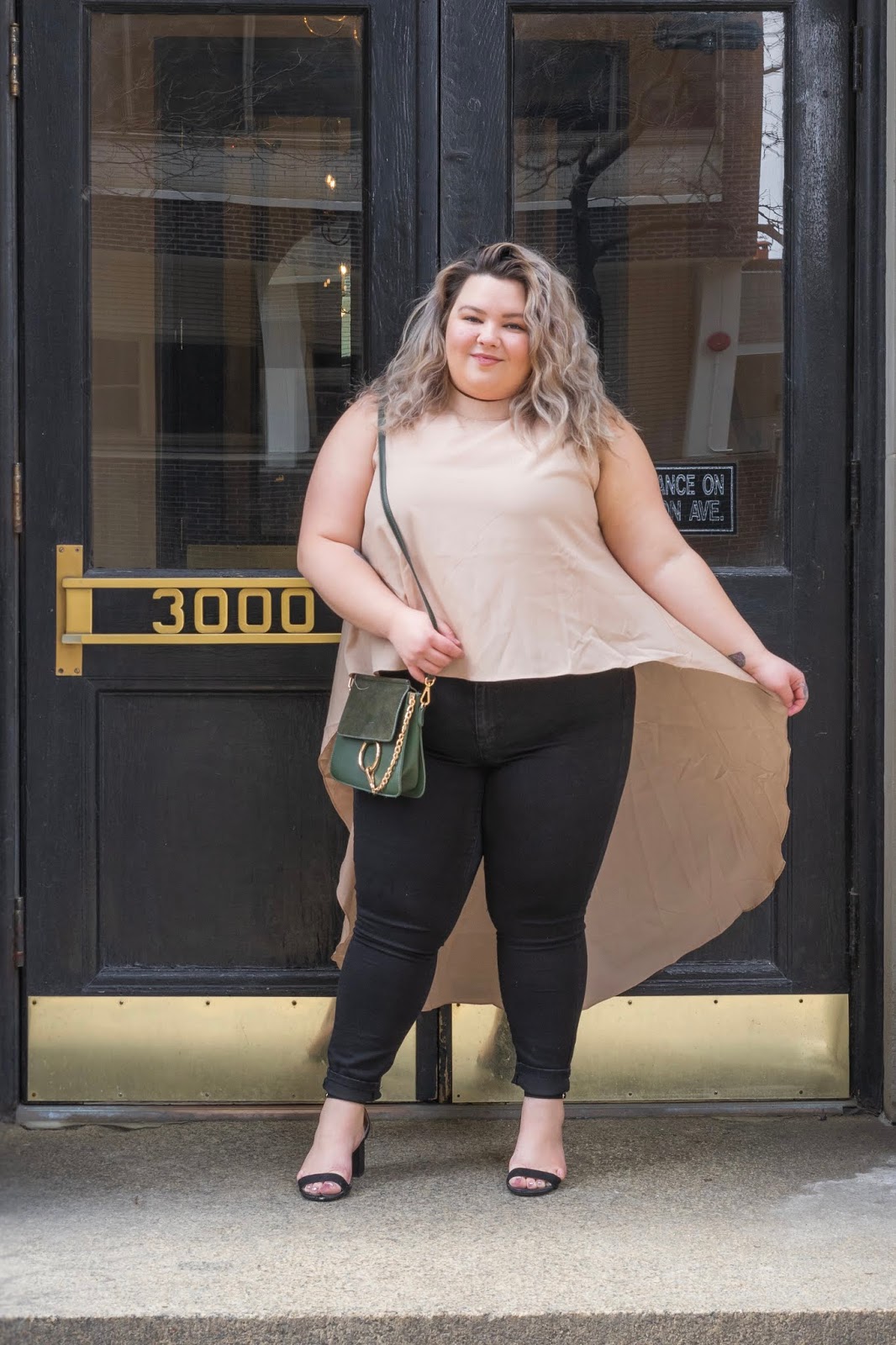 Chicago Plus Size Petite Fashion Blogger, YouTuber, and model Natalie Craig, of Natalie in the City, review's Fashion Nova's hi-lo tops and jeans.