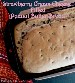 Strawberry Cream Cheese Filled Peanut Butter Bread gets its inspiration from peanut butter and jelly sandwiches. Mini chocolate chips add a little sweetness to the bread and Strawberry cream cheese filling is a fun surprise inside. | Recipe developed by www.BakingInATornado.com | #recipe #bake
