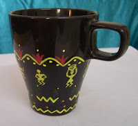 Creative Warli design on a coffee mug