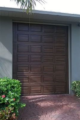 RV garage door painted like wood