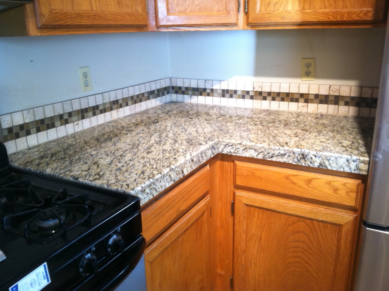 Santa Cecilia Granite with Tile Backsplash