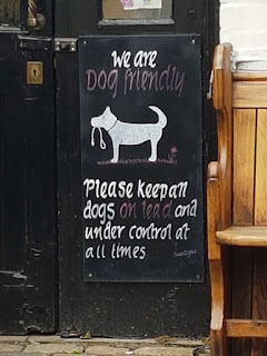 Dog-friendly pub sign; newsletter says more places should be dog-friendly