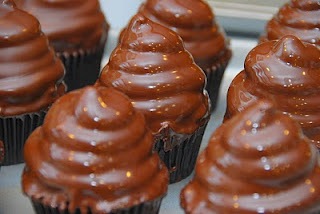 cupcakes with frosting swirl dipped in chocolate