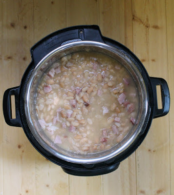 instant pot filled with cooked beans