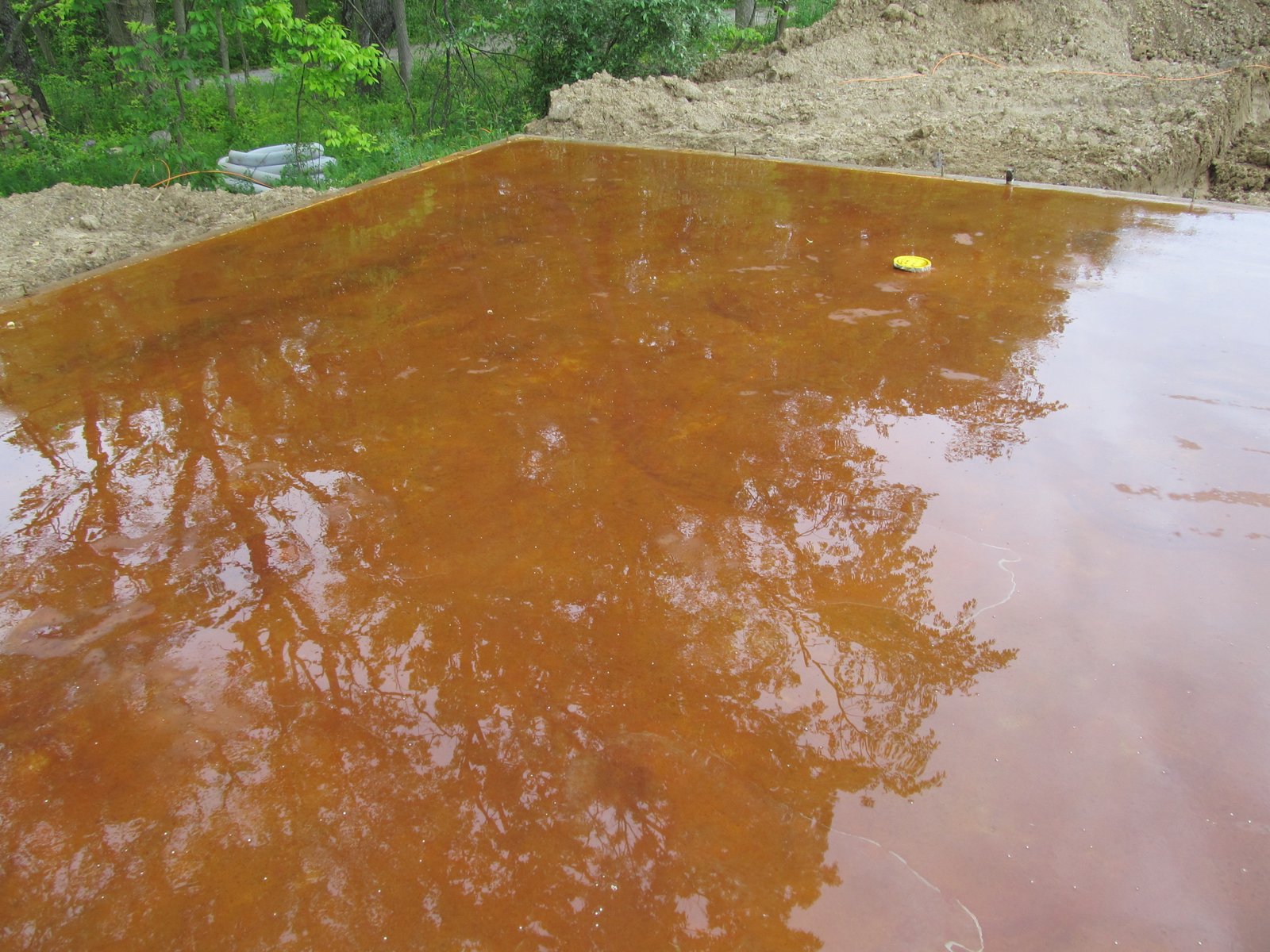 Thistle Creek House Staining the Slab Floor with Iron Sulfate