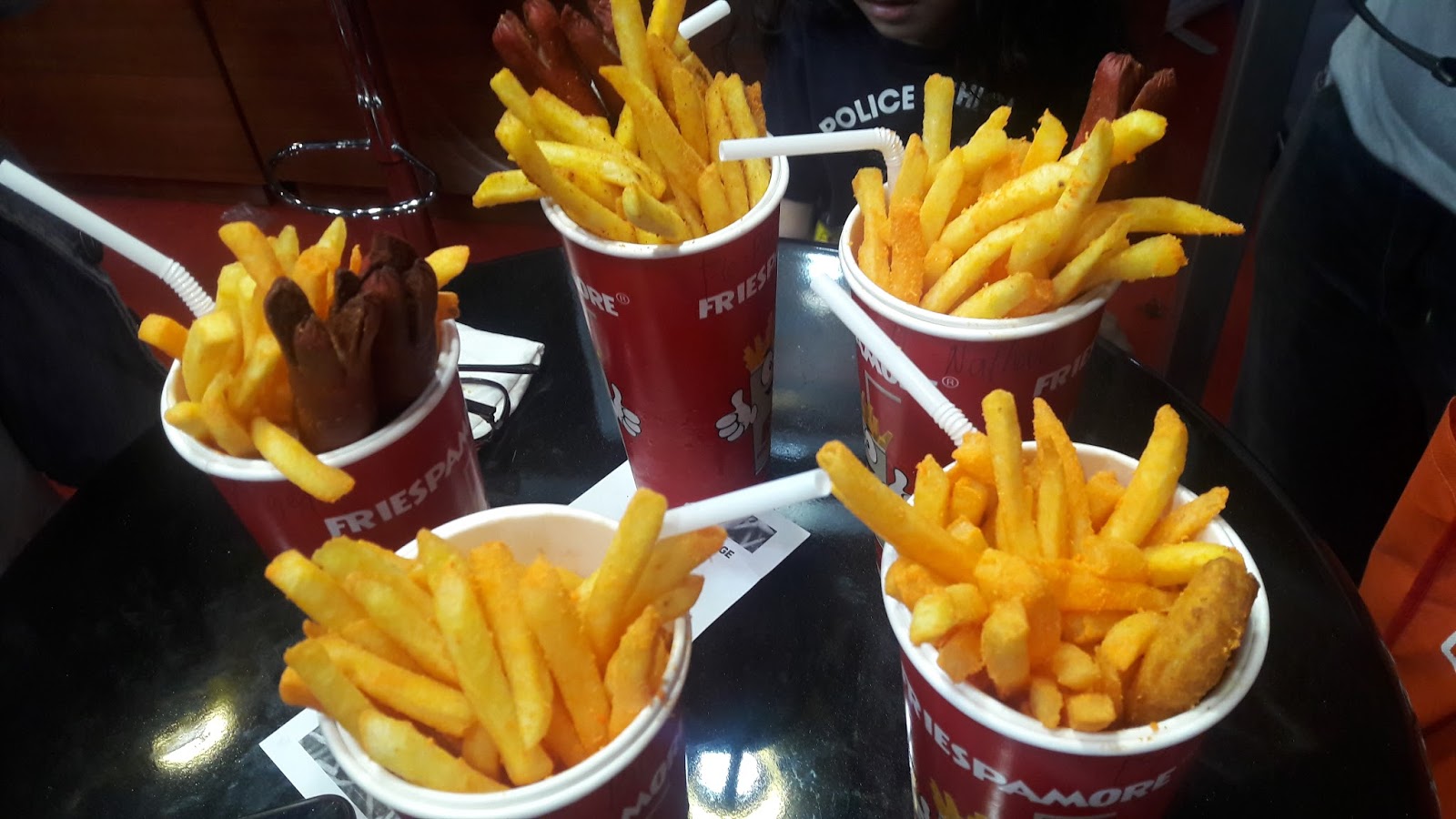 Eats a Travel Date FRIESPAMORE a gourmet fries and drink in one cup with various toppings