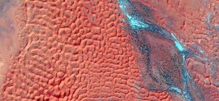 red dunes and blue river fantasy ,abstract landscapes of deserts of Africa,Abstract Naturalism,abstract photography deserts of Africa from the air,abstract surrealism, mirage Sahara, red dunes and blue river fantasy ,abstract landscapes of deserts of Africa