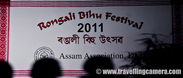 Rogali Bihu Festival 2011 by Assam Association, Delhi @ Indira Gandhi National Center of Arts, New Delhi, INDIA : Posted by VJ SHARMA on www.travellingcamera.com : 'Assam Association, Delhi' celebrated Rongali Bihu Festival on 24th April 2011 at Indira Gandhi National Center of Arts (IGNCA) on Ranjendra Prasaad Road near Central Secretariate Metro Station in Delhi !! This event took place during the lovely evening on Sunday in the presence of a huge audience in traditional getups. The attendance was large by Delhi standards and I am totally fan of Assamese Culture !!! Check out these Photographs from RONGALI BIHU FESTIVAL 2011 ....On Sunday morning I was chatting with one of my friend on Facbook and she told me about this event !! Although it was a lazy Sunday for me but I thought of not missing this opportunity to get out of the house and feel the heat of Delhi :)  I also took two office friends along and had a great evening !! This event continued till 11:00 pm but we had to leave early. That was a sad parfor us, as no one of us wanted to leave the place...Bohag Bihu is the national festival of Assamese as it marks the beginning of the New Year (Nava Varsha !!!). Rituals and customary practices of Bohag Bihu starts from April 13 of year. There are three forms of a Bihu festival namely Bohag Bihu or Rongali Bihu (in the middle of April), Magh Bihu or Bhogali Bihu (middle of January) and Kaati Bihu or Kongali Bihu (in October/ November). To start the program, a group of Assam association came and sang a beautiful song in their local language... It seems that song they sung was very significant and has good impact on Assamese culture !!!Rongali Bihu (Bohag Bihu) is the most important day of all the three Bihu festivals. This day begins with the sowing of seeds, Kaati Bihu marks the complete process of sowing and transplanting of paddies, and the Magh Bihu marks the end of the harvesting period.Here is the lady who managed the stage with another gentleman !!! I really loved the dressup of all the men and women thir... beutiful Saaris and kurtas !! No words to explain the uniqueness and the impressions of strong culture !!!It's just the beginning ! I was hoping some hip-hop :) ... But whole evening was packed with  various versions of Bihu Dance performances... I was asked to wait till the end for actual and the BIG Bihu performance, but I had no option :(The Bihu dance  is a folk dance from the Indian state of Assam related to the festival of Bihu. This joyous dance is performed by both young men and women and is characterized by brisk dance steps and rapid hand movement. Dancers wear traditionally colorful Assamese clothing and this adds more value to overall performance !!! Huchori - Huchori is an integral part of Rongali Bihu. Choral parties of singers and dancers moving from house to house is a salient feature of Rongali Bihu !!!A group of boys performed Hichuri on the stage and it was really interesting to see overall getup of folks in the groups and it seems elder folks also join this group to better guide theyounger ones :) .. Although I was not able to make any sense out of the songs or dialogs, but it looked very interesting !!!The word Bihu is derived from the language of the Dimasa Kacharis... Their supreme god is Brai Shibrai or Father Shibrai. The First crops of the season are offered to Brai Shibrai while wishing for peace and prosperity. So Bi means 