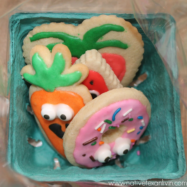 Shopkins Cookies in a strawberry container. Perfect goody bag idea for a Shopkins Party
