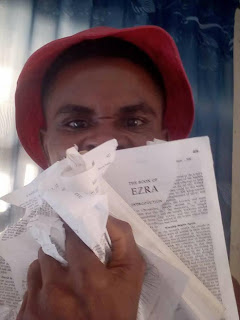 Photogist: Man Tears A Copy Of The Bible, Blames Catholic Priest