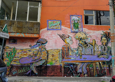 street mural on wall in Mexico skeletons drinking at tables