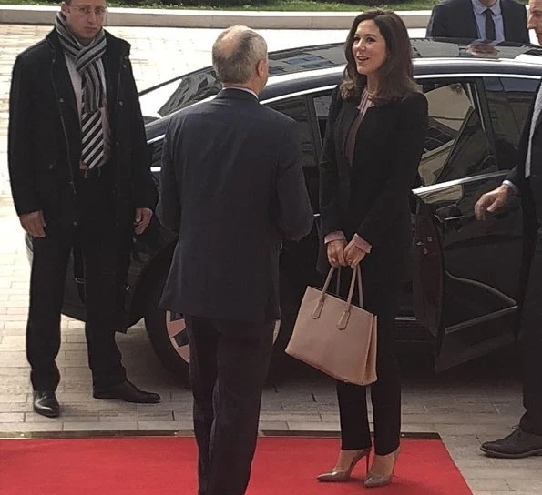 Crown Princess Mary wore Tibi Bell Sleeve Corset Stretch Crepe Top, Zara crepe frock coat, Piaget Possession long necklace, carried Prada bag