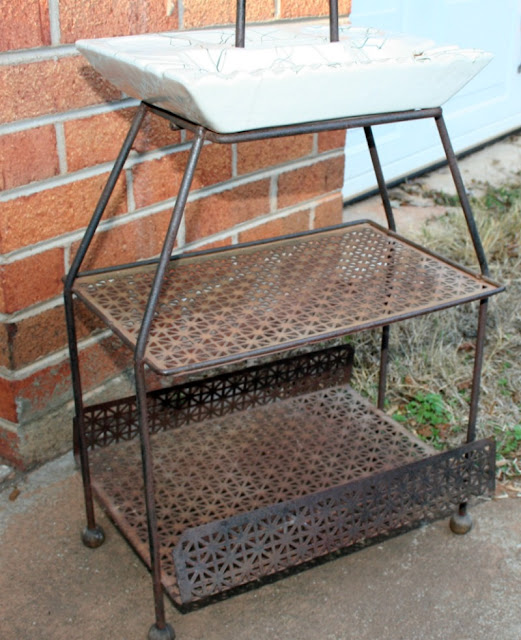 Give a Mid-Century Modern magazine rack new life with a coat of metallic spray paint!