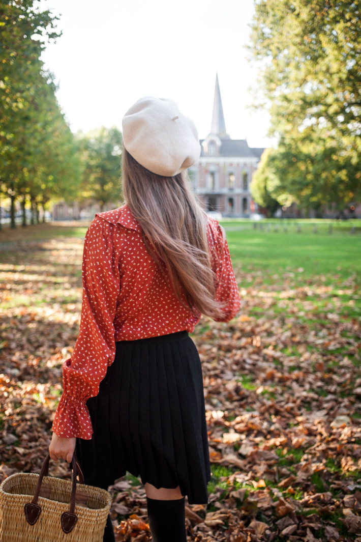 vintage fall outfit in ruffled blouse, knife pleated skirt and overknee socks
