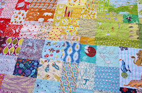Rainbow Patch Scrappy Baby Quilt by Heidi Staples of Fabric Mutt