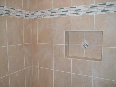 accent tiles in wall band and niche jazz up tan tile surround