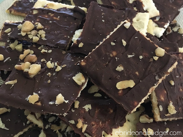 Looking for the perfect bridal shower treat? Or maybe a great summer potluck recipe. This Chocolate Cracker Bark is PERFECT. Get the recipe from www.abrideonabudget.com. #bridalshower #potluckrecipe #bbqrecipe #dessert #weddingdessert
