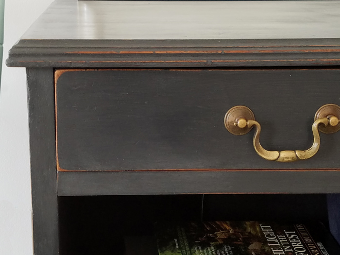 antique gold drawer pulls on dark cabinet