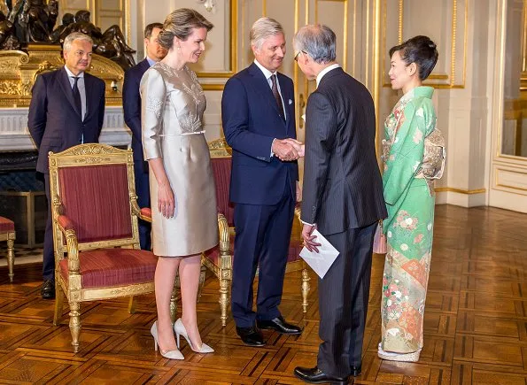 King Philippe and Queen Mathilde hosted traditional New Year reception at the Royal Palace. Queen wore Natan dress and pumps