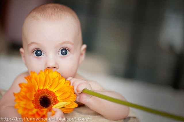 Funny baby and flower.