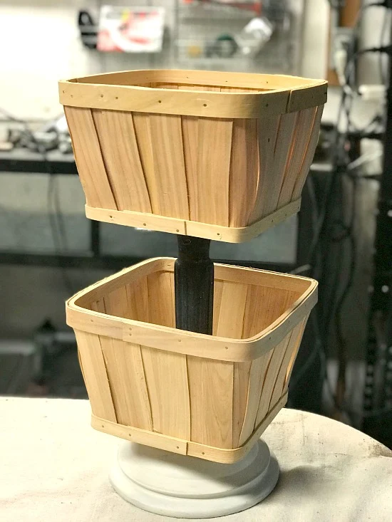 Using baskets to create a tiered planter.