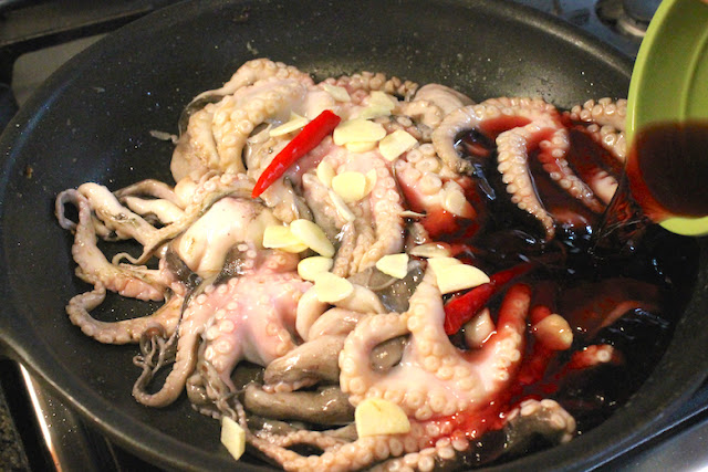 Food Lust People Love: Grilled Baby Octopus. Grilled baby octopus: The octopus is cooked until tender with garlic, hot chili peppers and red wine, then grilled to add smoky flavor and crunch. #SundaySupper
