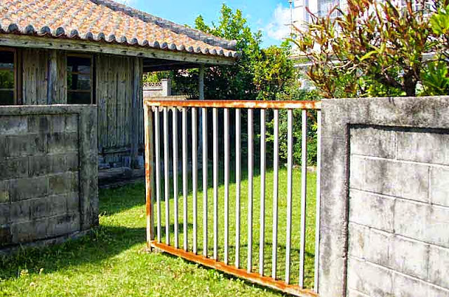 iron gate, red tlied roof,traditional home