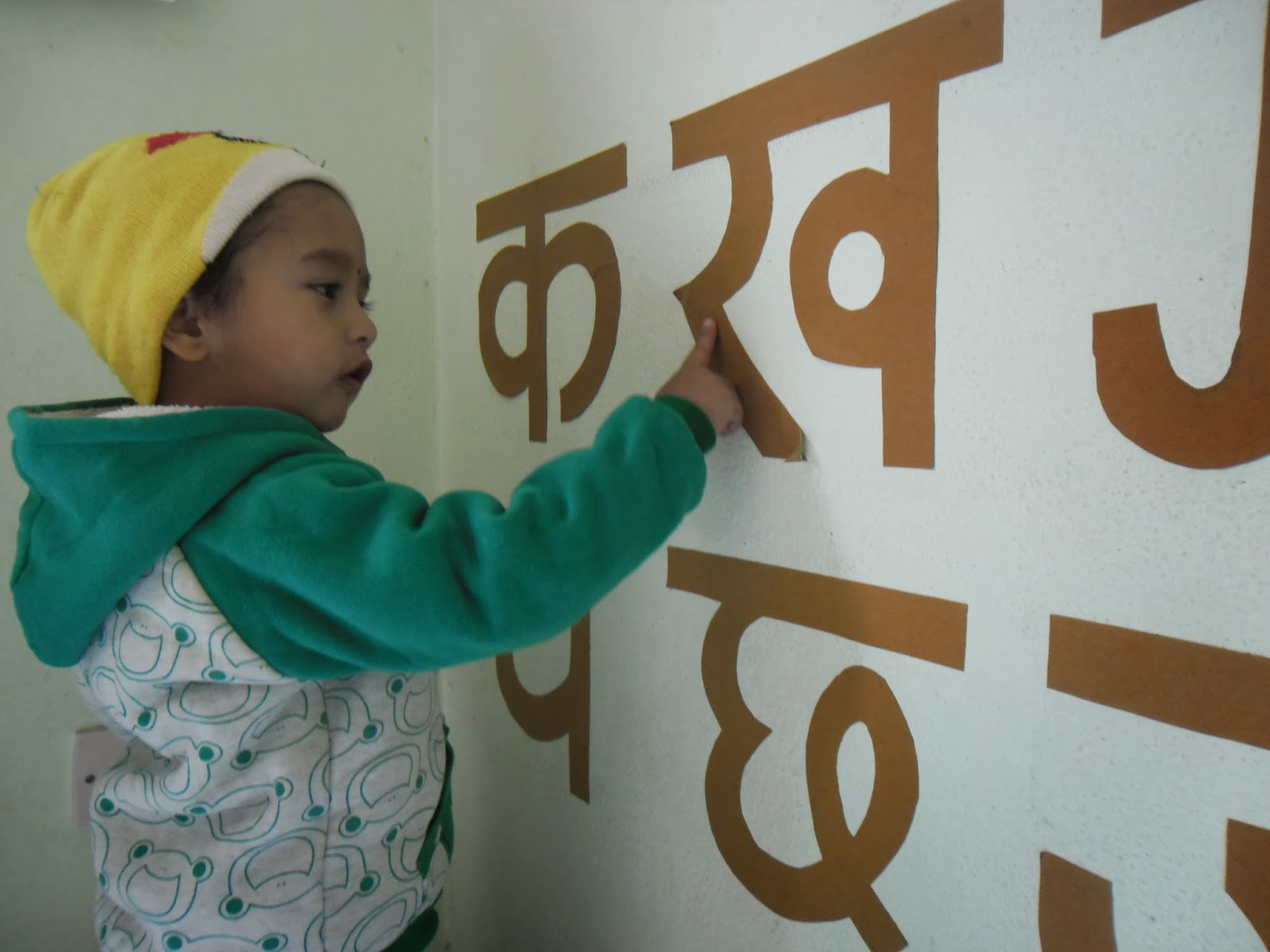 Happy Crayons School Teaching Nepali Alphabets to beginners Nursery